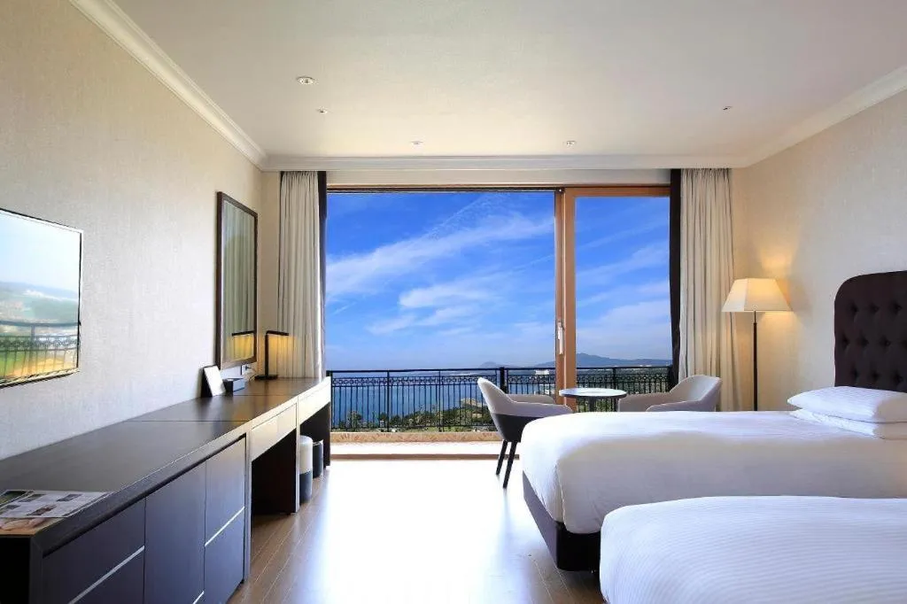 Bed in Jeju Booyoung Hotel