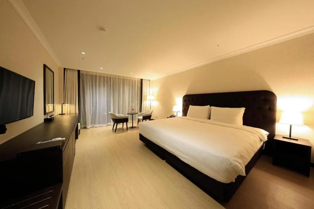 Bed in Jeju Booyoung Hotel