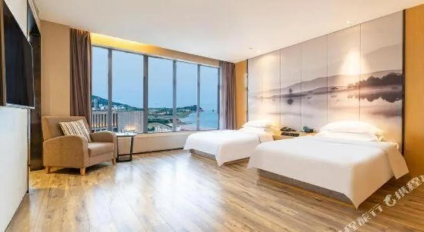 Bed in Qingdao Elegance Hotel