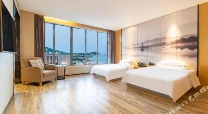 Bed in Qingdao Elegance Hotel