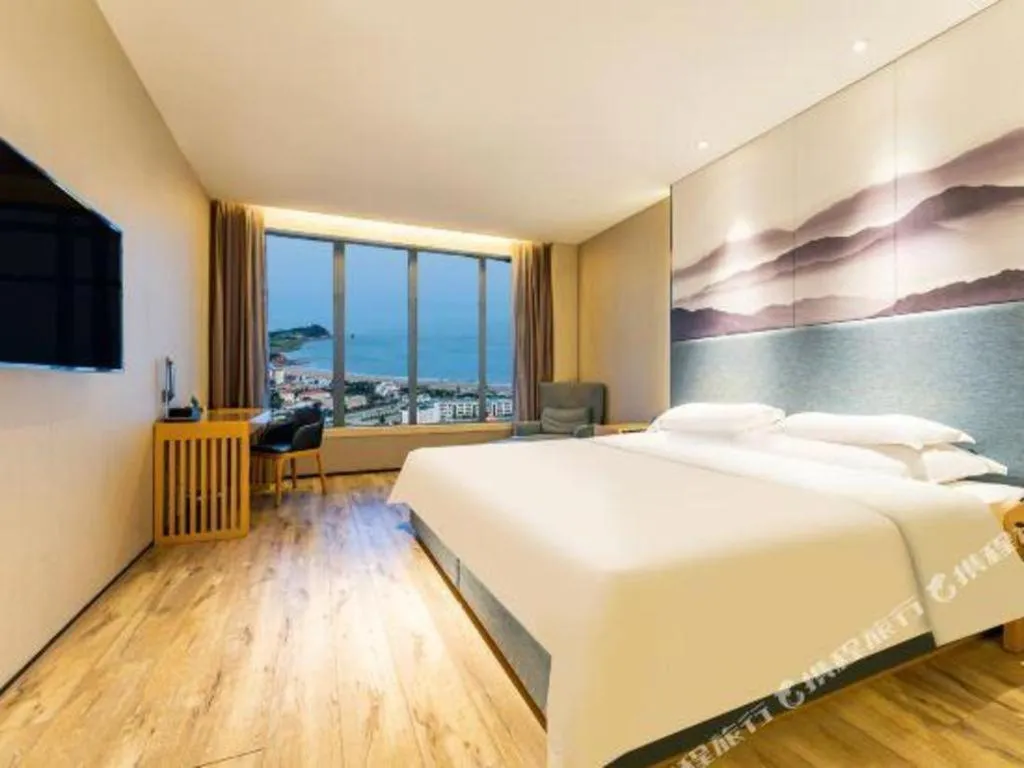 Bed in Qingdao Elegance Hotel