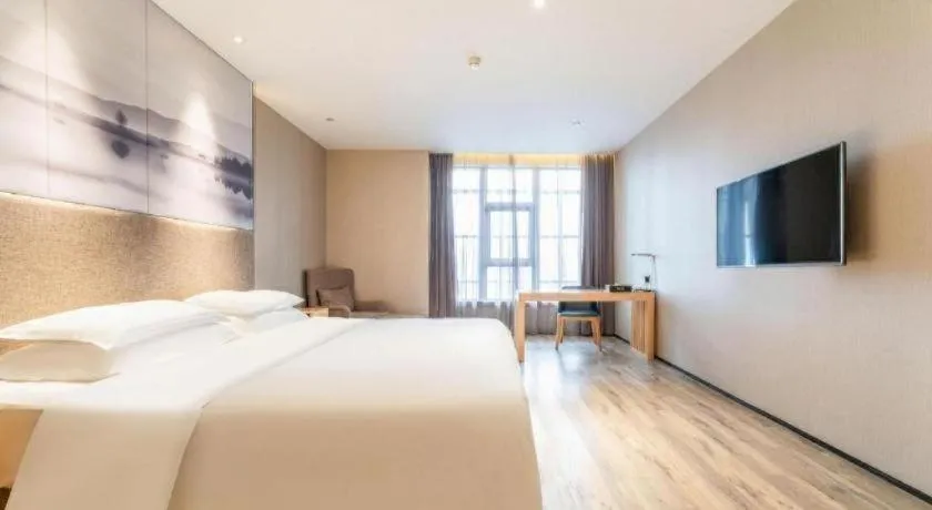 Bed in Qingdao Elegance Hotel