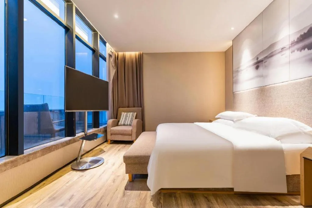 Bed in Qingdao Elegance Hotel