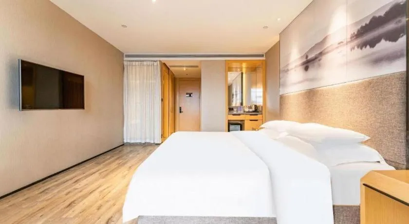 Bed in Qingdao Elegance Hotel