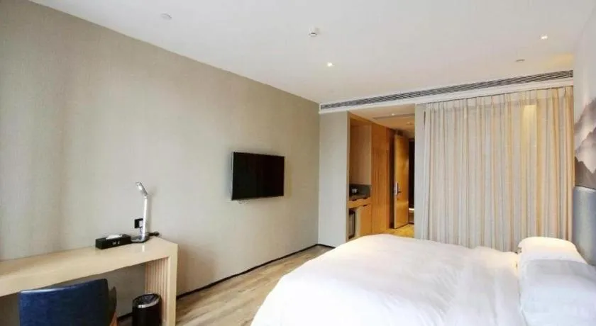 Bed in Qingdao Elegance Hotel