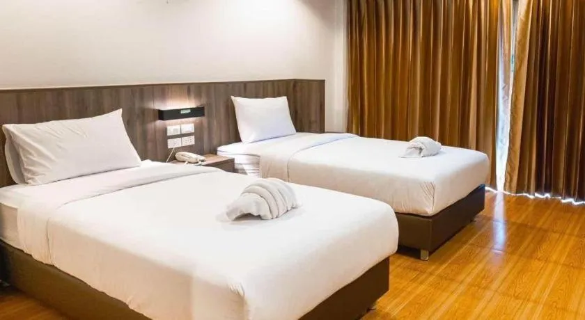 Bed in The Impress Nan Hotel