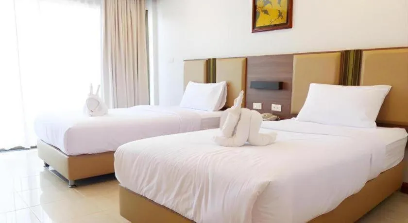 Bed in The Impress Nan Hotel