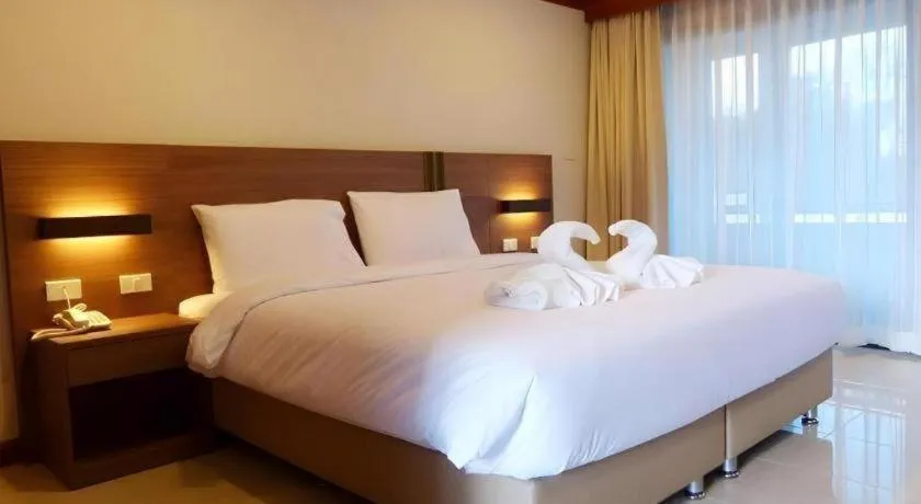 Bed in The Impress Nan Hotel