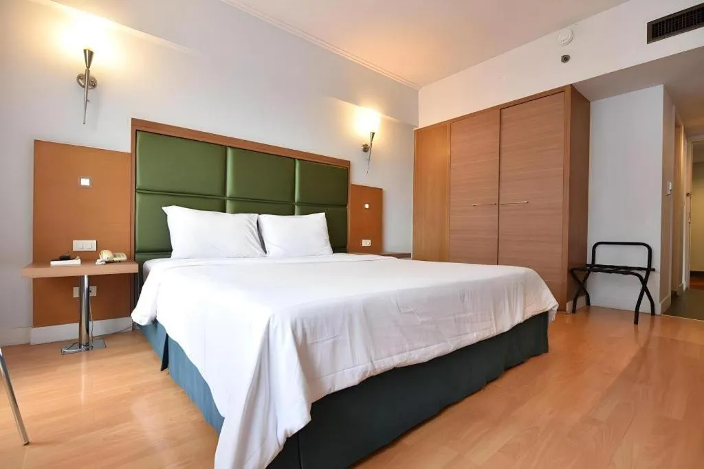 Bed in Mayflower Grande Hotel