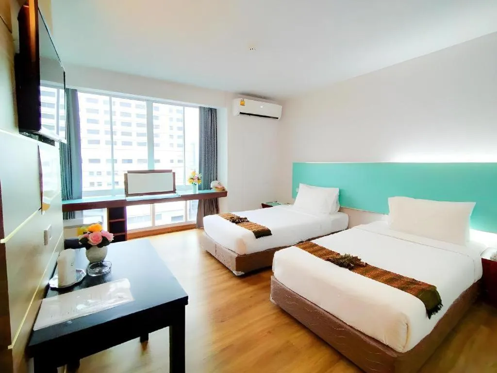 Bed in Mayflower Grande Hotel