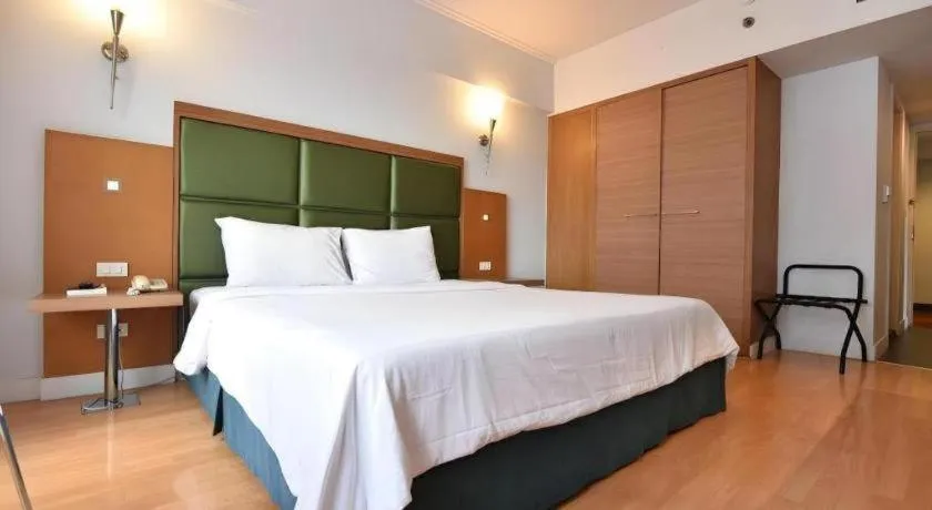 Bed in Mayflower Grande Hotel