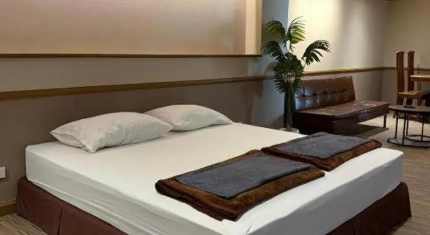 Bed in Alameda Suites Hotel