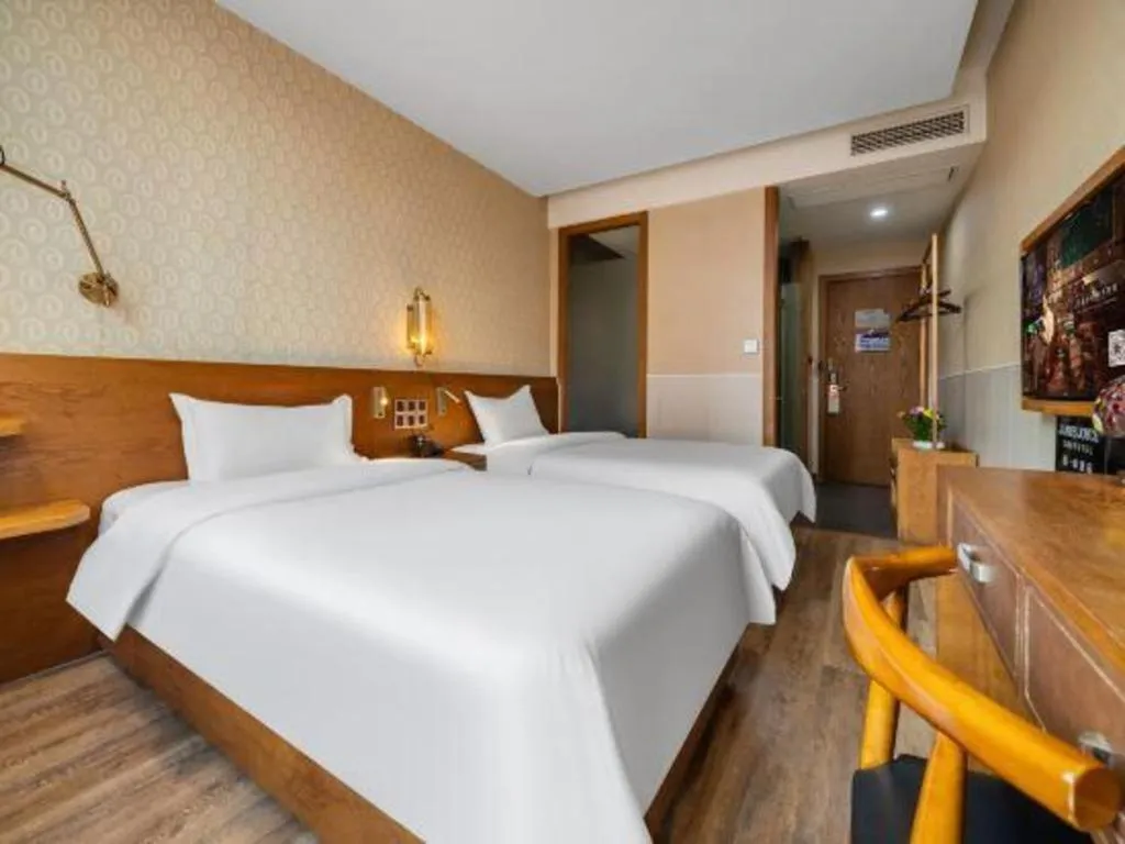 Bed in James Joyce Coffetel Wuxi Taihu Square Subway Station Branch