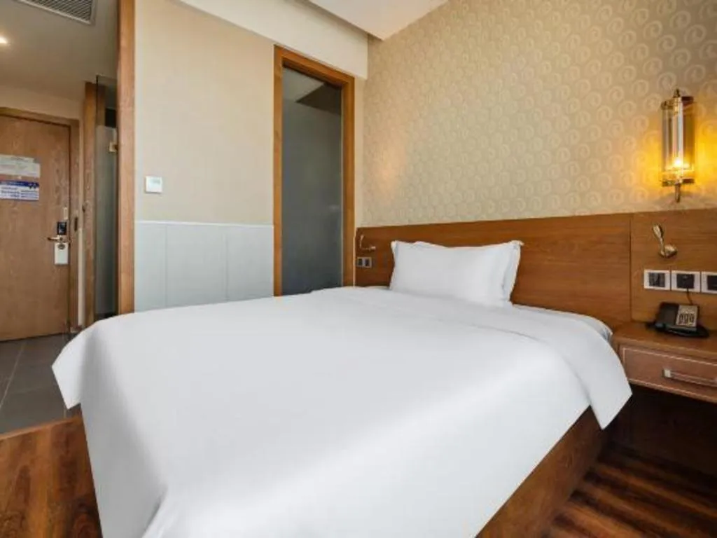 Bed in James Joyce Coffetel Wuxi Taihu Square Subway Station Branch