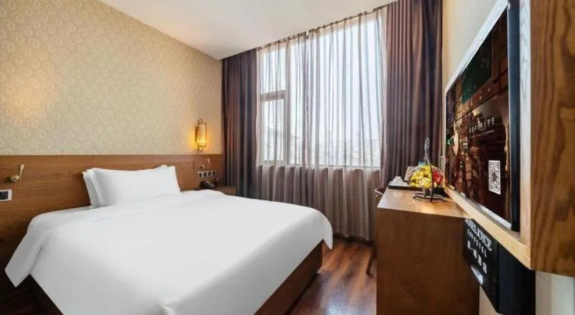 Bed in James Joyce Coffetel Wuxi Taihu Square Subway Station Branch