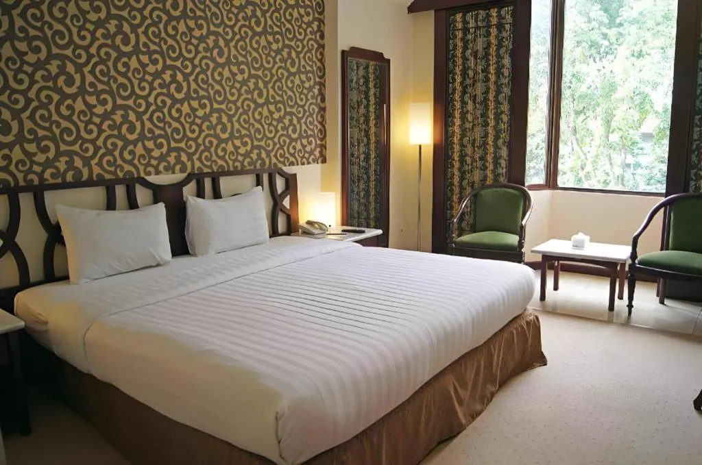 Bed in Grand Hotel Surabaya