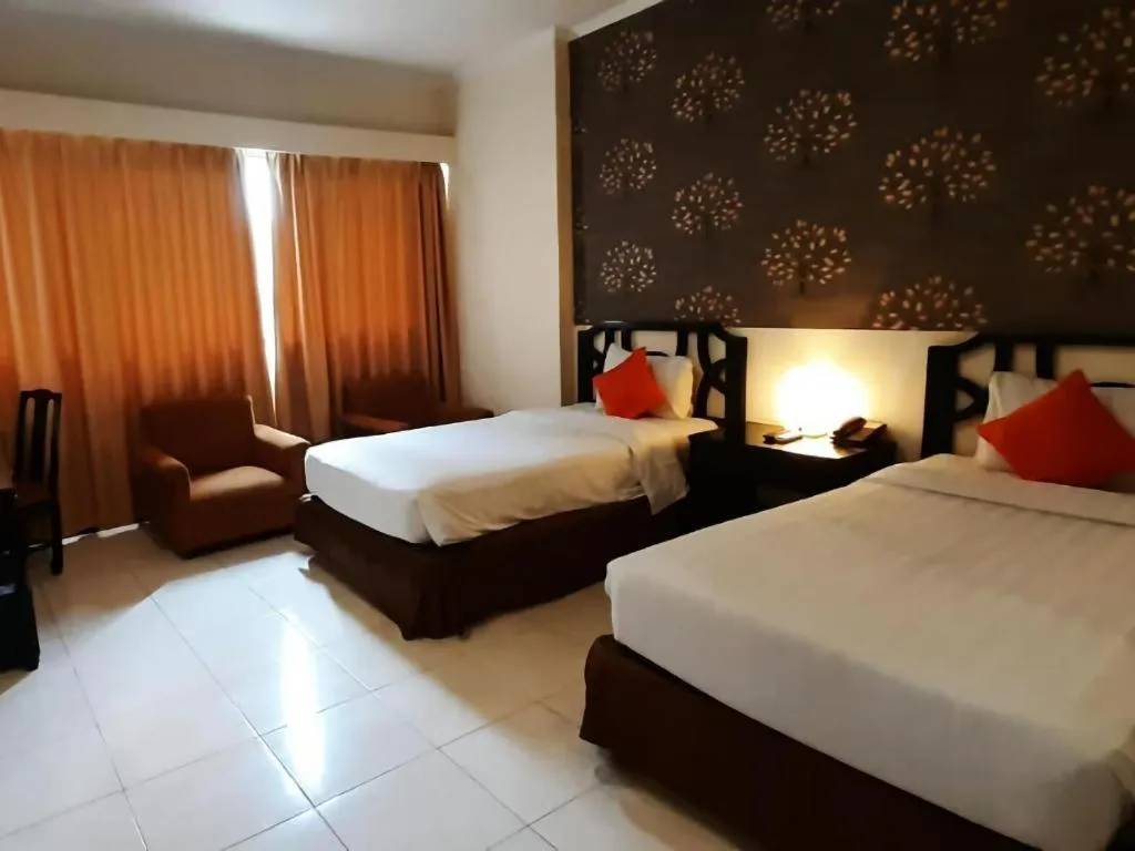 Bed in Grand Hotel Surabaya