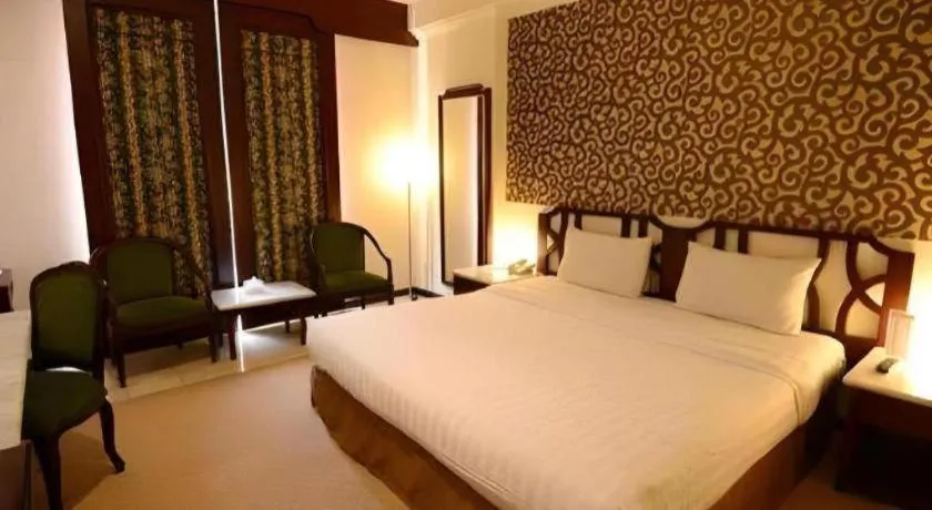 Bed in Grand Hotel Surabaya