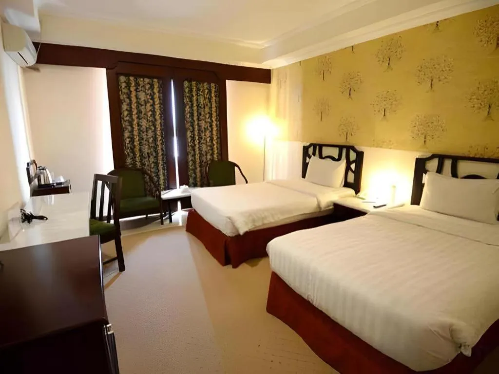 Bed in Grand Hotel Surabaya