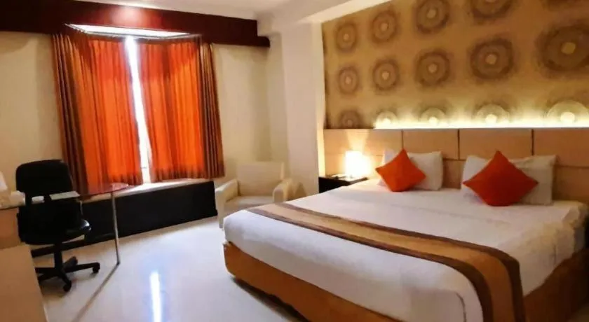 Bed in Grand Hotel Surabaya