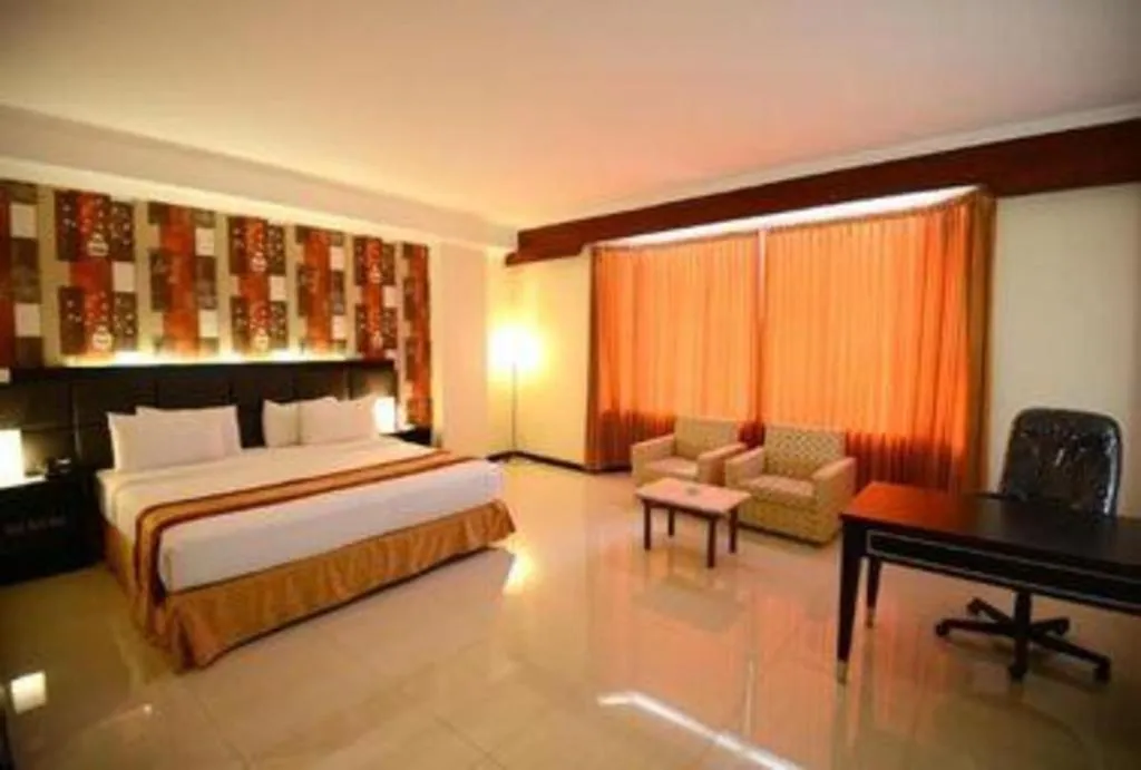 Bed in Grand Hotel Surabaya