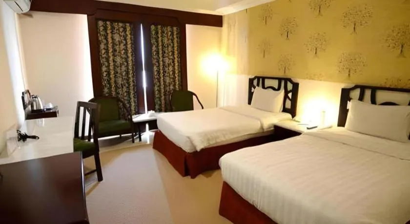 Bed in Grand Hotel Surabaya