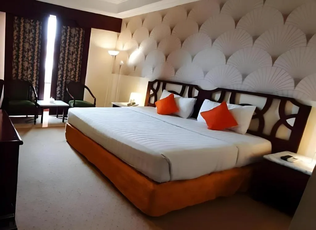 Bed in Grand Hotel Surabaya
