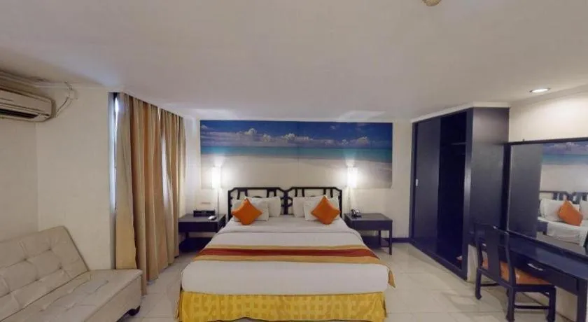 Bed in Grand Hotel Surabaya