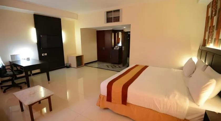Bed in Grand Hotel Surabaya