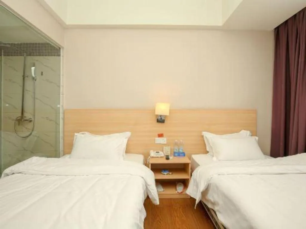 Bed in Pankun Business Hotel