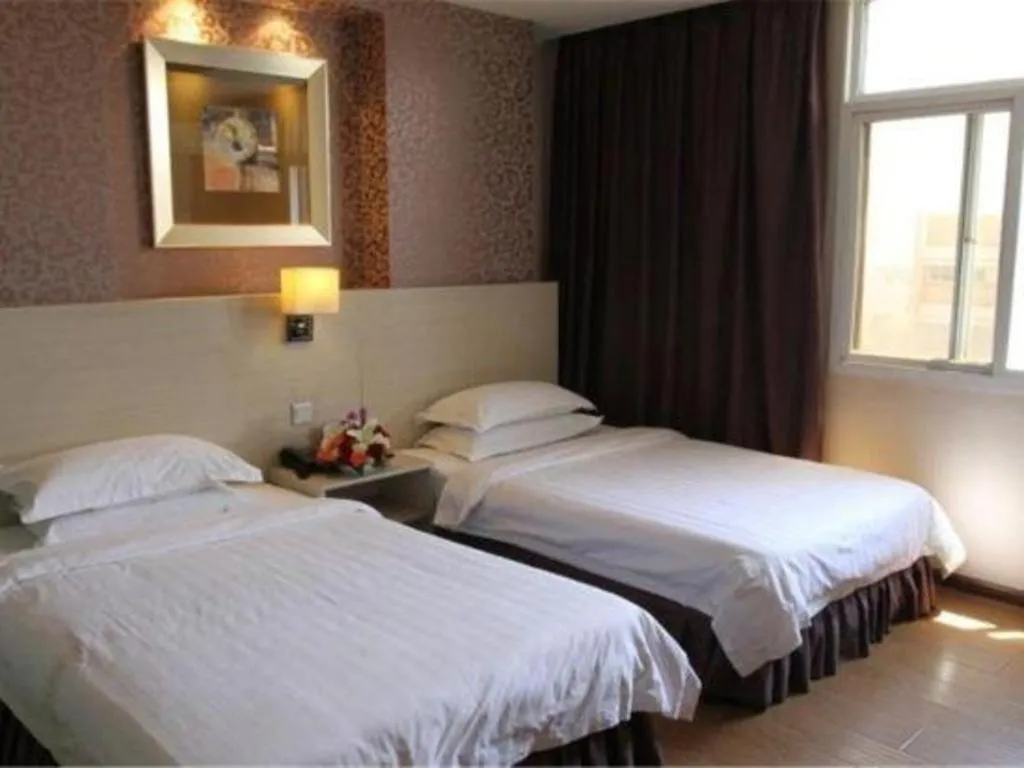 Bed in Pankun Business Hotel