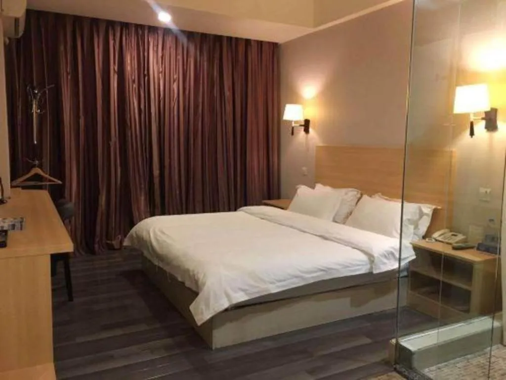 Bed in Pankun Business Hotel