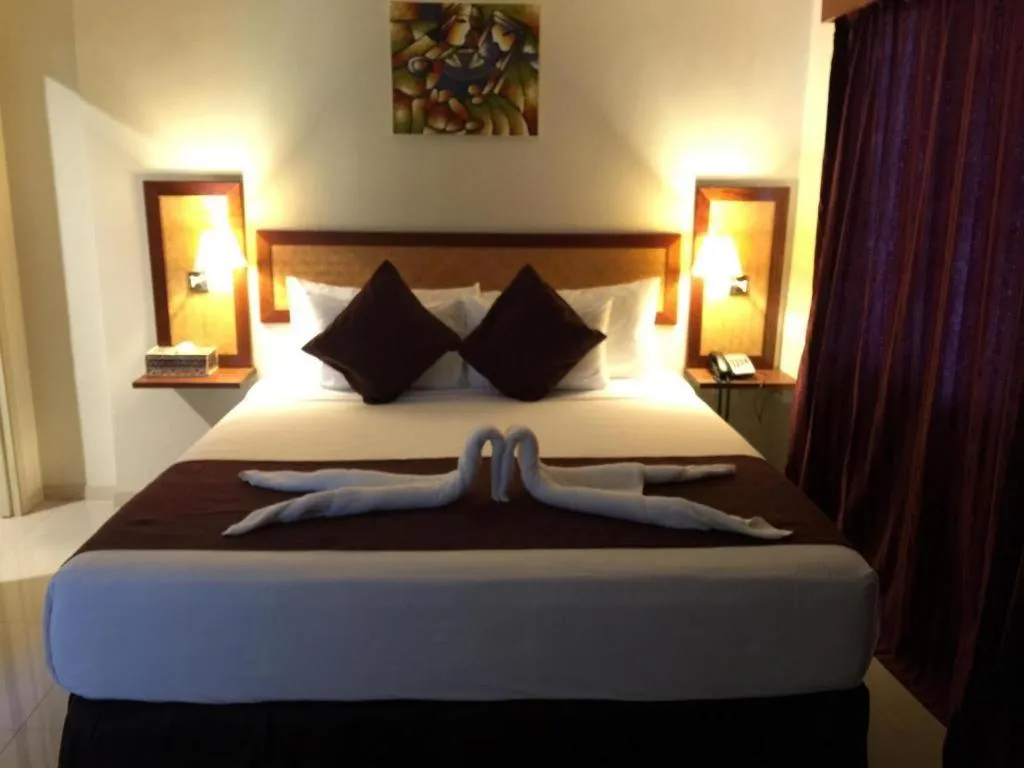 Bed in Victoria Palms Hotel