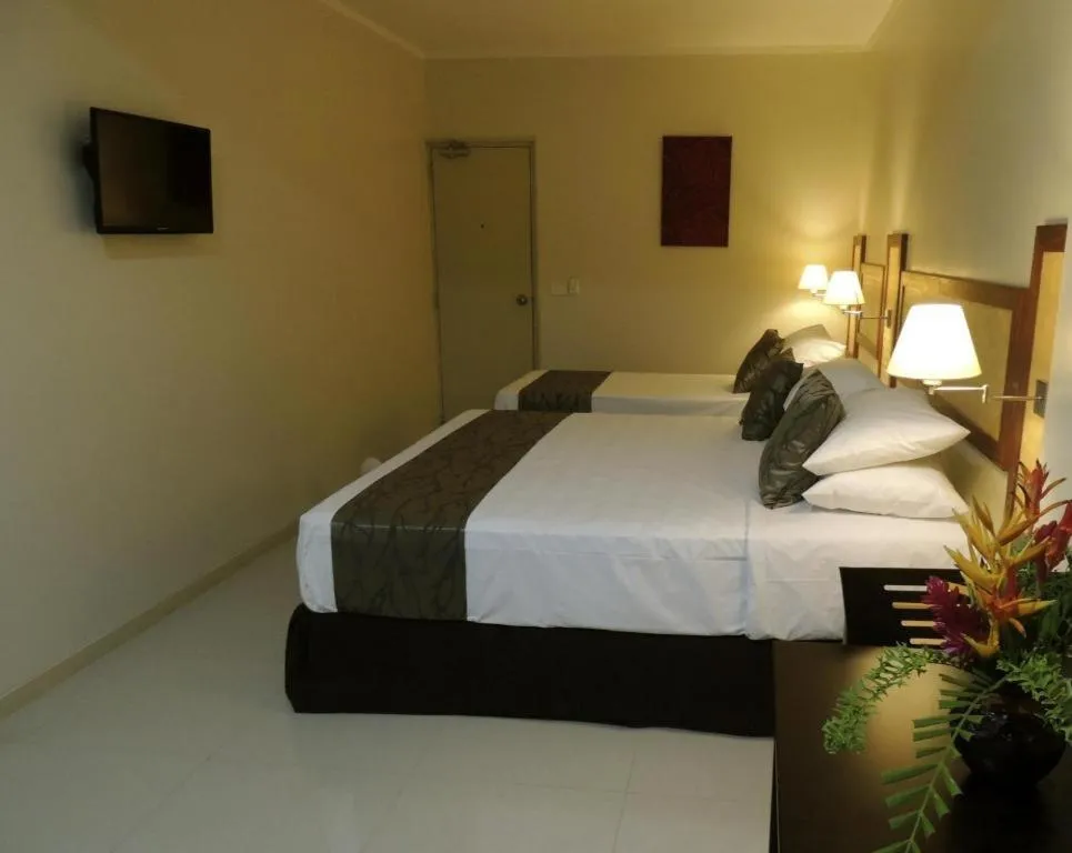 Bed in Victoria Palms Hotel