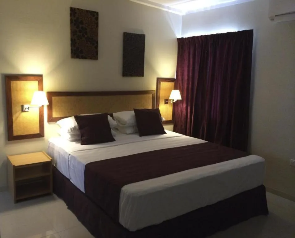 Bed in Victoria Palms Hotel