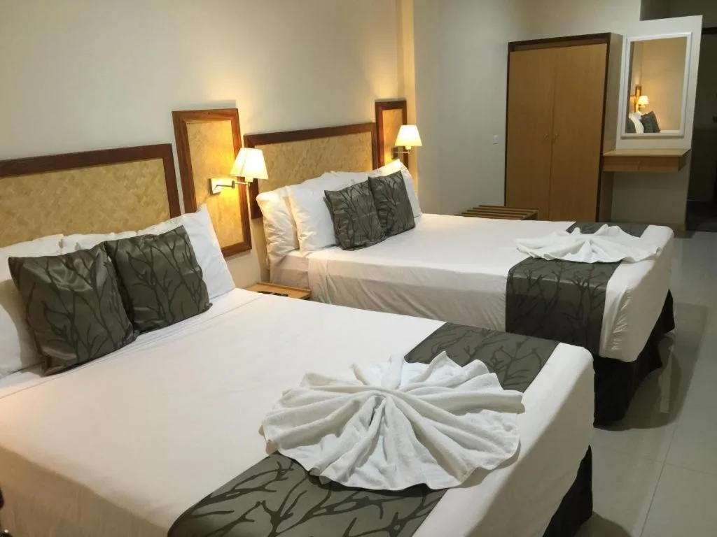 Bed in Victoria Palms Hotel