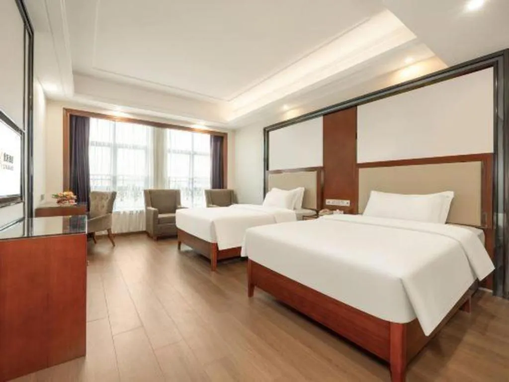 Bed in Vienna International Hotel Nanning Railway Station Mingxiu Road Metro Station