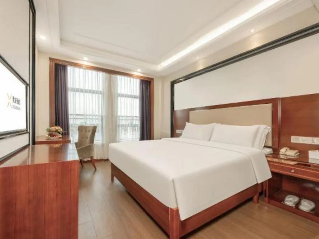 Bed in Vienna International Hotel Nanning Railway Station Mingxiu Road Metro Station