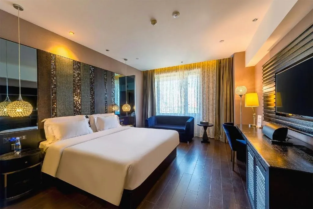 Bed in Guangzhou Crystal Orange Hotel