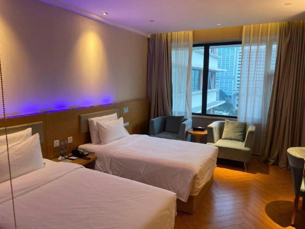 Bed in Guangzhou Crystal Orange Hotel