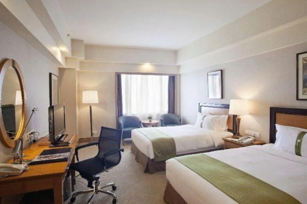 Bed in Guangzhou Crystal Orange Hotel