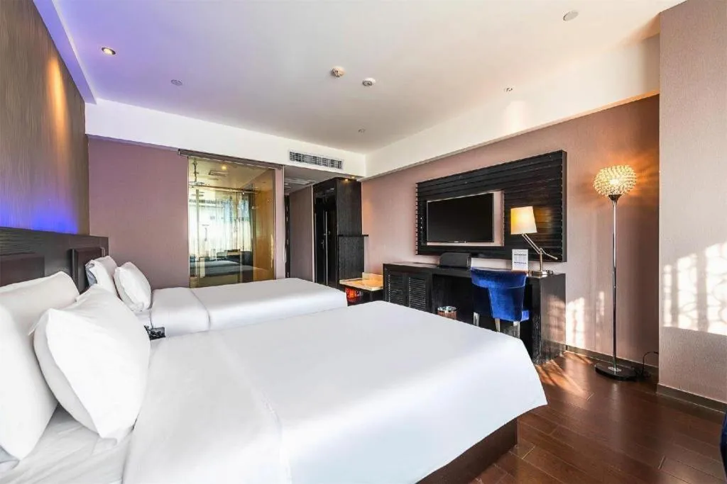 Bed in Guangzhou Crystal Orange Hotel