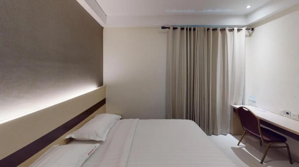 Bed in Sumi Hotel Surabaya