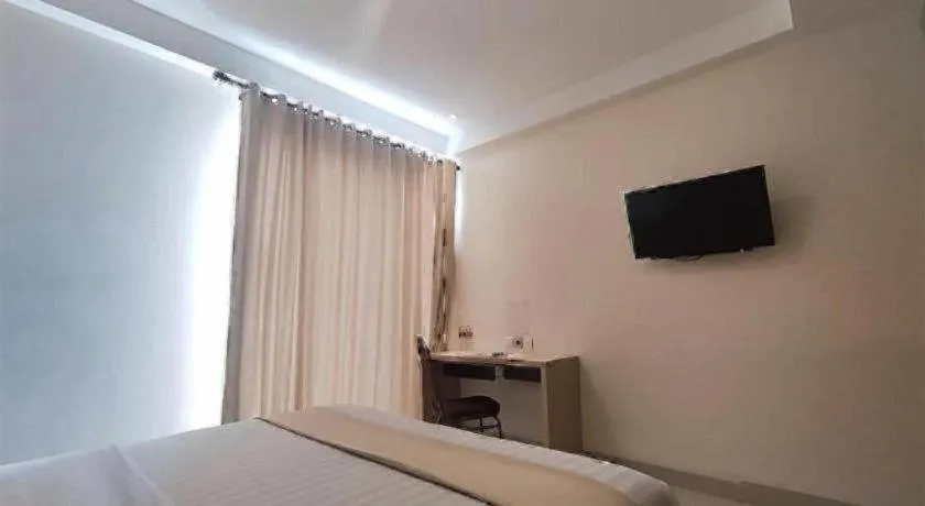 Bed in Sumi Hotel Surabaya