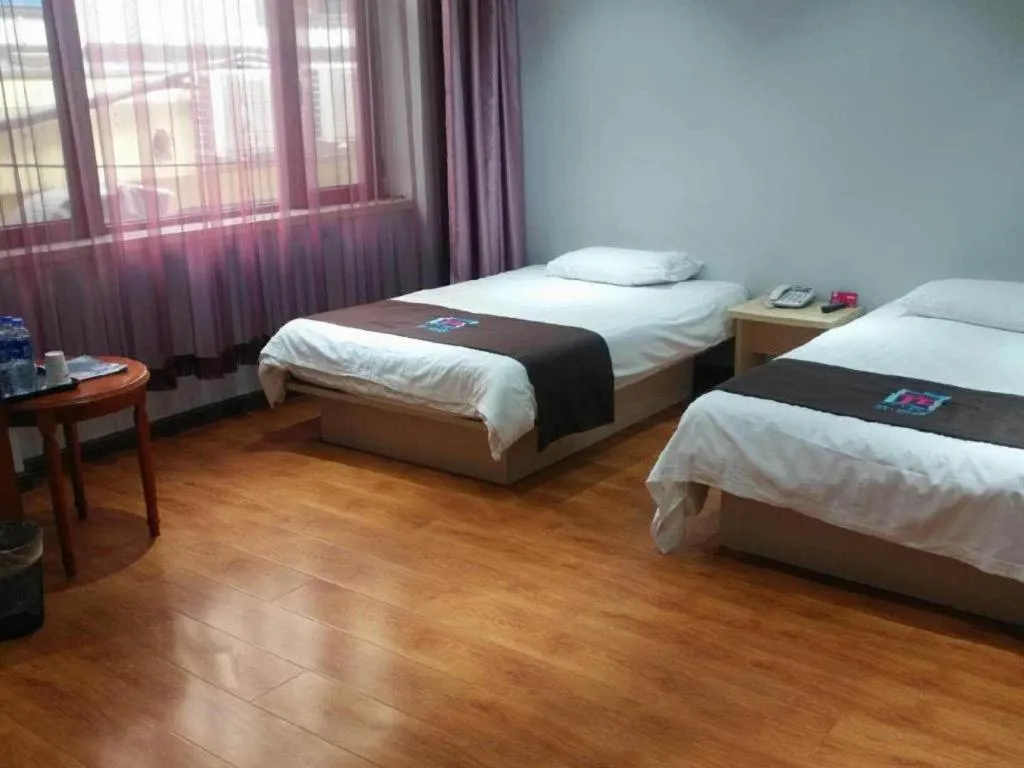 Bed in Pai Hotel Tianjin Binguan Metro Station Municipal Government