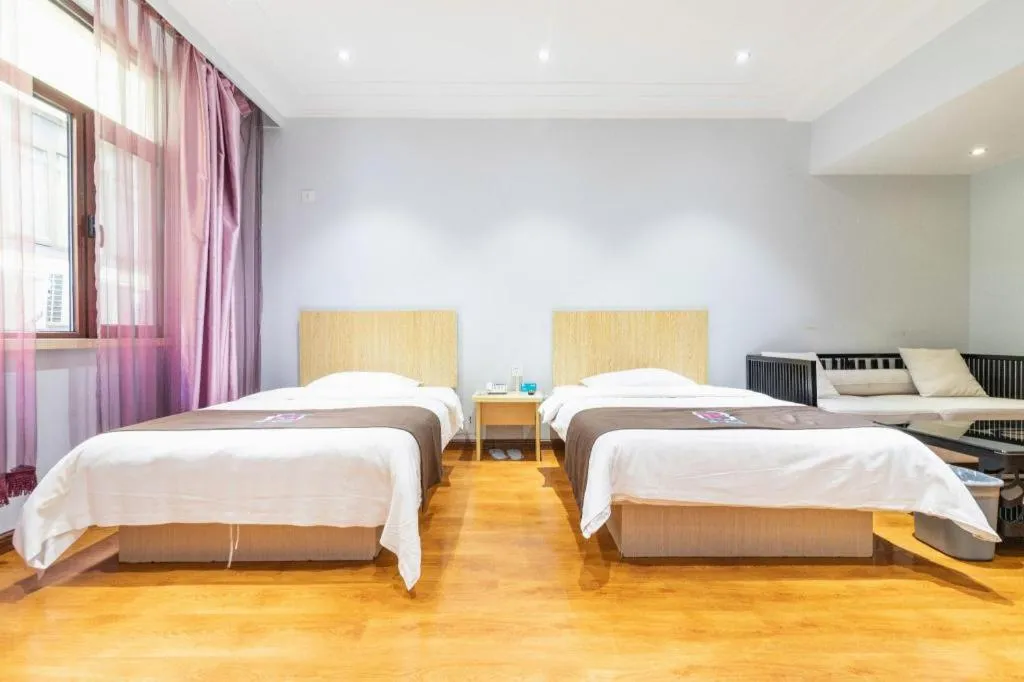 Bed in Pai Hotel Tianjin Binguan Metro Station Municipal Government