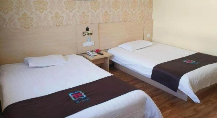 Bed in Pai Hotel Tianjin Binguan Metro Station Municipal Government