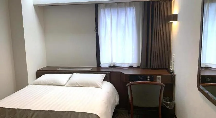 Bed in Hotel Suncity Ikebukuro