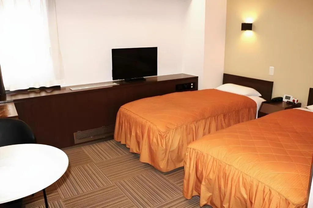 Bed in Hotel Suncity Ikebukuro