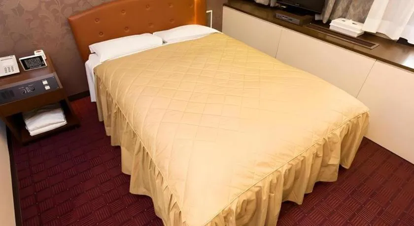 Bed in Hotel Suncity Ikebukuro